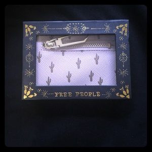 Wallet with designs from free people.